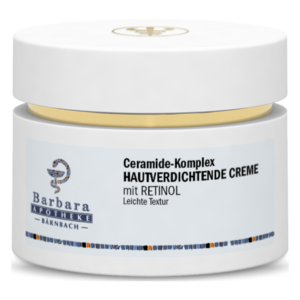 Weißes Cremetöpfchen mit goldener Kappe, beschriftet mit "Hautverdichtende Creme mit Retinol" und "Ceramide-Komplex".