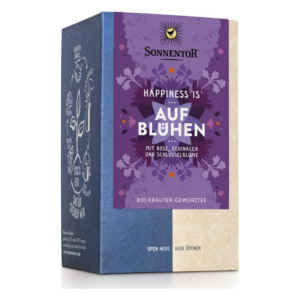 Bunte Verpackung von Sonnentor mit dem Aufdruck 'Happiness is aufblühen', enthält Bio-Kräuter-Gewürztee mit Rose und Echinacea.