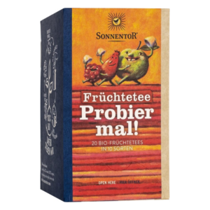 Verpackung für Früchtetee von Sonnentor mit bunten Früchte-Cartoonfiguren und dem Text "Probiere mal!".