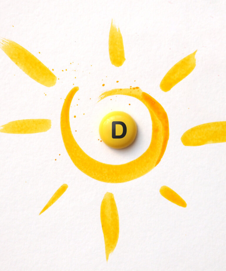 Gelbe Malerei eines Sonnenmotivs mit einer runden, gelben Pille mit dem Buchstaben D in der Mitte.