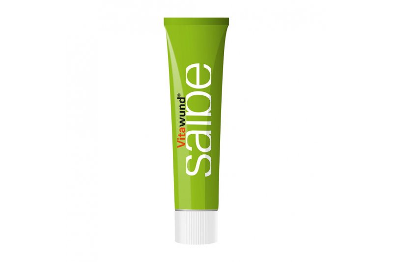 vitawundSalbe-40g.jpg Grüne Tube mit der Aufschrift "Vitawund Salbe", die für die Hautpflege verwendet wird.